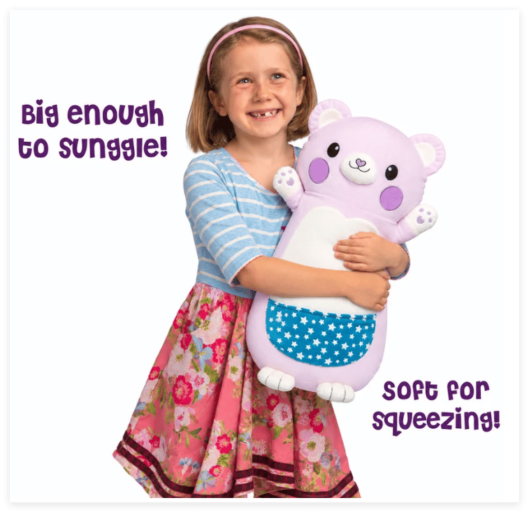 Smiling girl hugging a large purple bear plush with blue star-patterned pocket