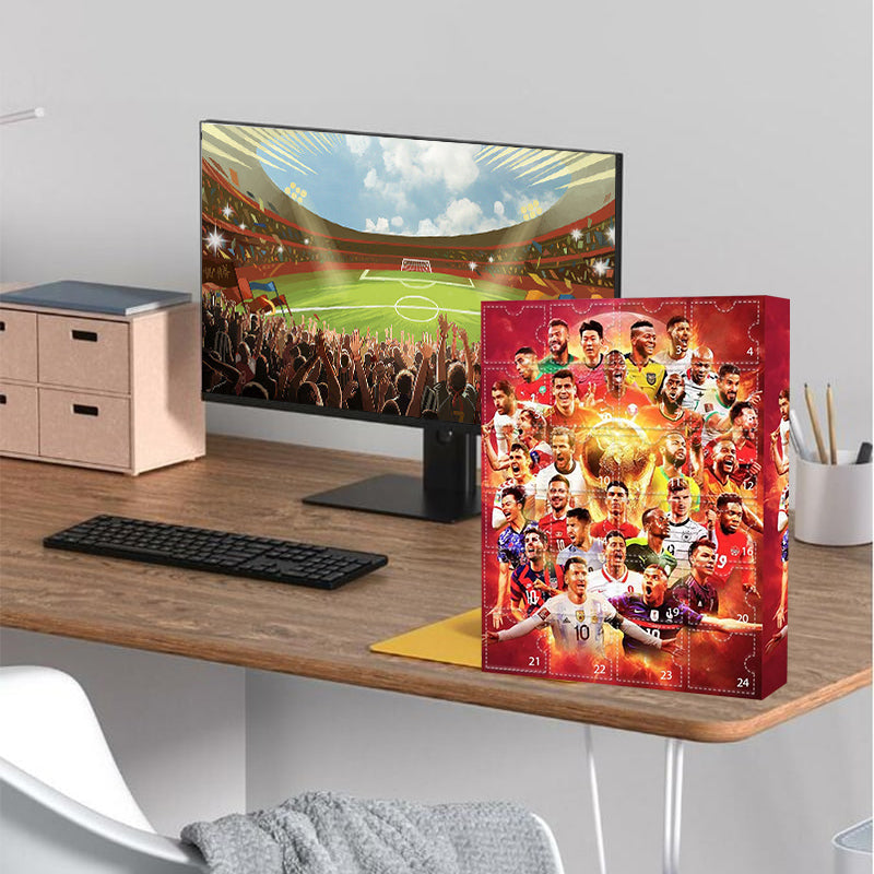 Football advent calendar styled on a desk beside a stadium display