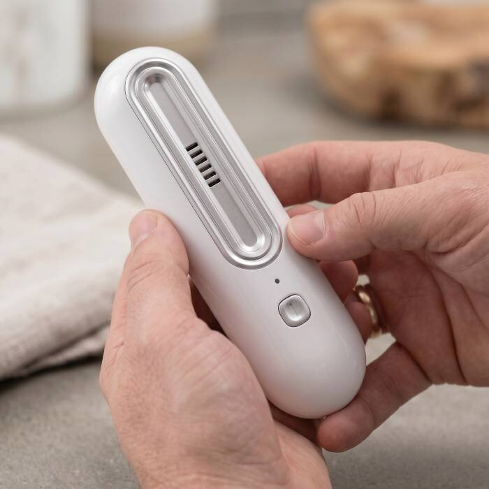 OzoFreshen handheld product close-up