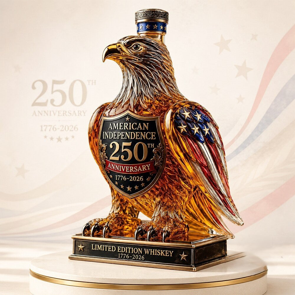 American Independence 250th Anniversary eagle-shaped whiskey bottle with amber-colored body and red white blue wings