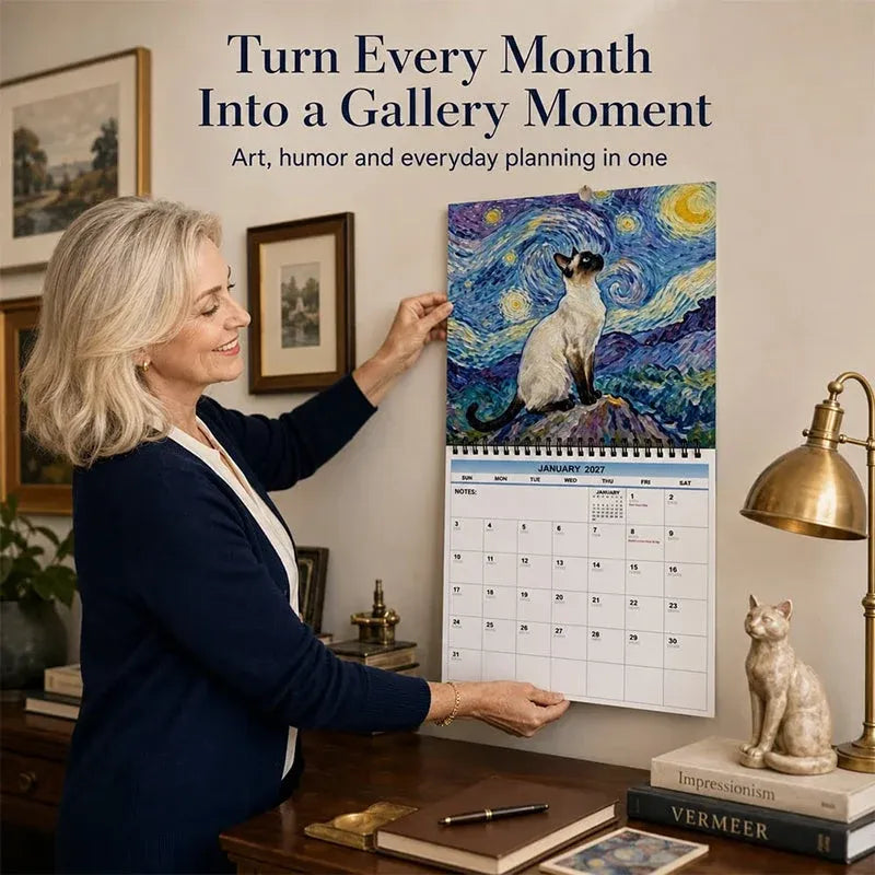 2027 cat art calendar displayed on wall in home office